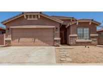 Charming single-story home featuring a two-car garage and beautiful stone accents at 2025 S 83Rd Dr, Tolleson, AZ 85353