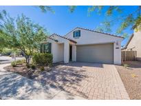 Charming single-story home featuring a two-car garage, low-maintenance landscaping, and a neutral color palette at 20644 W Mariposa St, Buckeye, AZ 85396