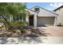 Inviting single-Gathering home with a desert-landscaped front yard and a brick-paved driveway at 20644 W Mariposa St, Buckeye, AZ 85396