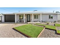 Charming single-story home featuring an inviting front porch and low-maintenance landscaping at 2129 W Indianola Ave, Phoenix, AZ 85015