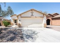 Charming single-story home with a two-car garage and low maintenance landscaping at 2174 W Kristina Ave, San Tan Valley, AZ 85144