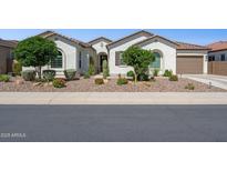 Charming single-story home with desert landscaping, a tile roof, and an attached garage at 31320 N 54Th Pl, Cave Creek, AZ 85331