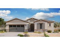 Charming single-story home featuring a stone facade, a two-car garage, and a well-manicured desert landscape at 8552 N 175Th Ln, Waddell, AZ 85355