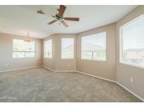 Spacious carpeted bedroom features large windows providing ample natural light and views at 9820 N Central Ave # 212, Phoenix, AZ 85020