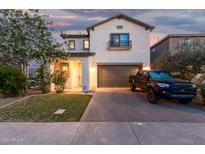 Charming two-story home showcasing a well-kept lawn and paved driveway with a black Toyota truck at 11541 E Corbin Ave, Mesa, AZ 85212