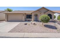 Charming single-story home with a well-manicured desert landscape and welcoming entryway at 1519 E Indian Wells Dr, Chandler, AZ 85249