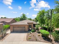 Charming single-story home with a well-maintained front yard and a neutral-colored exterior at 27581 N 129Th Ln, Peoria, AZ 85383
