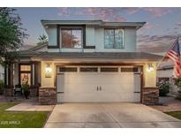 Charming two-story home featuring a two-car garage, landscaped yard, and inviting facade at 3466 E Bruce Ave, Gilbert, AZ 85234