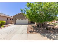 Charming single-story home featuring a two-car garage, desert landscaping, and a welcoming entrance at 3507 E Alfalfa Dr, Gilbert, AZ 85298