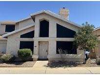 Charming front elevation of a two-story home with a well-manicured lawn and inviting entrance in a sunny neighborhood at 4210 W Rosemonte Dr, Glendale, AZ 85308