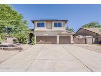 Two-story home with a spacious driveway and a two-car garage at 656 W Devon Ct, Gilbert, AZ 85233
