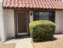 Charming home featuring a front door, address numbers and tile roof at 6605 N 46Th Ln, Glendale, AZ 85301