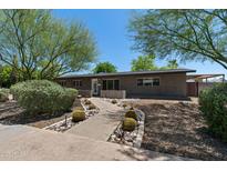 Charming single-story home with desert landscaping and a welcoming walkway to the front door at 105 E Hermosa Dr, Tempe, AZ 85282