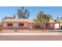 Charming single-story home with desert landscaping in the front yard, providing curb appeal at 1413 W 7Th Pl, Tempe, AZ 85281