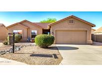Single-story home featuring a xeriscaped front yard and two-car garage with a neutral-toned exterior at 1492 E Westchester Dr, Chandler, AZ 85249