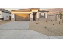 Beautiful single-story home with a two-car garage and low maintenance desert landscaping at 24066 W Cocopah St, Buckeye, AZ 85326