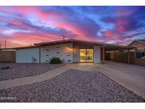 Charming home with a colorful sky, desert landscaping, and a convenient carport at 316 N Ironwood --, Mesa, AZ 85201