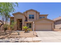 Two-story home with desert landscaping and a two car garage at 33512 N 24Th Ln, Phoenix, AZ 85085