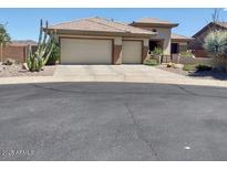 Charming single-story home with a well-maintained front yard and a convenient two-car garage at 41215 N Lytham Ct, Phoenix, AZ 85086