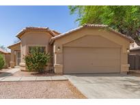 Charming single-story home featuring a well-maintained front yard and an attached two-car garage at 5439 W Sands Rd, Glendale, AZ 85301