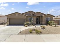 Beautiful single-story home featuring desert landscaping, a two-car garage, and neutral stucco exterior at 6213 W Gambit Trl, Phoenix, AZ 85083