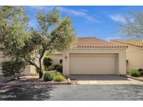 Charming single-Gathering home featuring a two-car garage, beautiful tile roof, and inviting desert landscaping at 7101 W Beardsley Rd # 1502, Glendale, AZ 85308