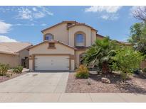 Charming two-story home featuring a spacious two-car garage and well-manicured landscaping at 725 W Beth Dr, Phoenix, AZ 85041