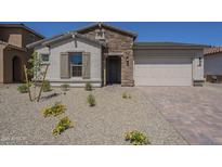 Charming single-story home with stone accents and desert landscaping at 11002 N 164Th Dr, Surprise, AZ 85388