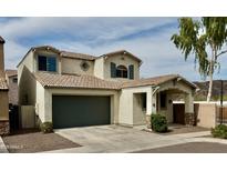 Charming two-story home with a spacious garage and landscaped front yard at 22507 N 31St Ave # 11, Phoenix, AZ 85027