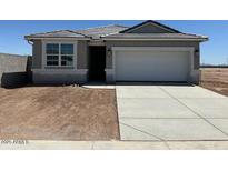 Charming single-story home featuring neutral tones, a two-car garage, and drought-tolerant landscaping at 38065 W Frascati Ave, Maricopa, AZ 85138