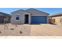 Charming single-story home featuring a blue garage door, low-maintenance landscaping, and brick paver driveway at 4211 W Lisa Ln, San Tan Valley, AZ 85144