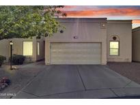 Inviting single-story home with a two-car garage and a well-maintained front yard at 7006 E Jensen St # 48, Mesa, AZ 85207