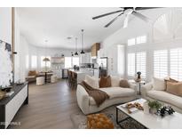 Bright, open-concept living room showcasing modern design with kitchen island, and stylish furniture at 802 N Lisbon Dr, Chandler, AZ 85226