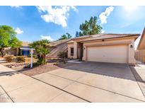 Charming single-story home featuring a two-car garage and a well-maintained, xeriscaped front yard at 1022 S Butte Ln, Gilbert, AZ 85296