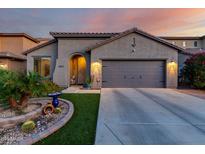 Charming single-story home with desert landscaping, and a two car garage at 11829 W Patrick Ln, Sun City, AZ 85373