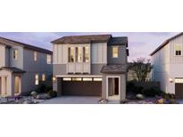 Charming two-story home features a two-car garage, neutral palette, and manicured desert landscaping at 2465 W Rowel Rd, Phoenix, AZ 85085