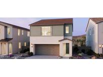 Charming two-story home with neutral colors, a garage, and well-manicured landscaping at 2478 W Rowel Rd, Phoenix, AZ 85085