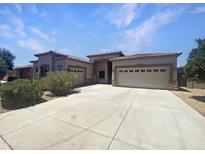 Charming single-Gathering home featuring a three-car garage and desert landscaping at 2971 N Rosewood Ave, Casa Grande, AZ 85122
