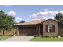 Charming single-story home featuring a stone facade and a well-maintained front yard at 36545 W Maddaloni Ave, Maricopa, AZ 85138
