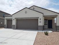 Charming single-Gathering home featuring a two-car garage and low-maintenance landscaping at 4032 N 308Th Dr, Buckeye, AZ 85396