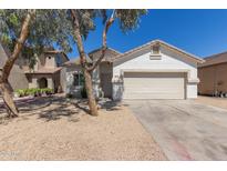 Charming single-story home featuring a two-car garage and low maintenance desert landscaping at 5635 S 11Th Dr, Phoenix, AZ 85041