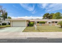 Charming single-story home with a two-car garage and well-maintained front yard at 10137 W Forrester Dr, Sun City, AZ 85351