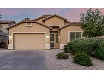 Charming single-story home features neutral stucco, well-maintained landscaping, and an attached two-car garage at 15515 N 165Th Ave, Surprise, AZ 85388