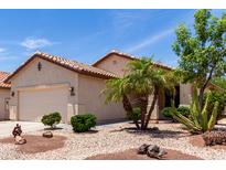 Inviting single-story home with well-maintained landscaping and a two-car garage at 22508 W Antelope Trl, Buckeye, AZ 85326