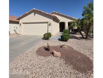 Charming single-story home with a two-car garage and low-maintenance desert landscaping in front yard at 22508 W Antelope Trl, Buckeye, AZ 85326