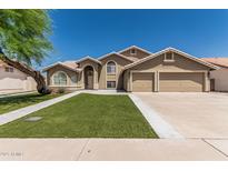 Charming two-story home boasts a three car garage, manicured lawn, and neutral color palette at 2723 N Winthrop --, Mesa, AZ 85213
