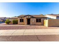 Charming single-story home featuring desert landscaping, a tile roof, and neutral-toned stucco walls at 7317 S 37Th Gln, Phoenix, AZ 85041