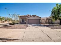 Charming single-story home with a well-maintained front yard and a spacious two-car garage at 7405 W Elwood St, Phoenix, AZ 85043