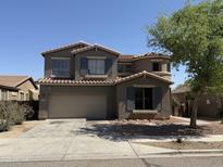 Two-story home featuring a symmetrical facade, a two-car garage, and low-maintenance landscaping at 7422 W Superior Ave, Phoenix, AZ 85043