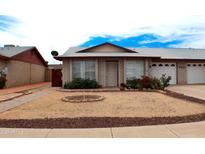 Charming single-story home with well-kept front yard and inviting curb appeal in a well-established neighborhood at 9625 W Mountain View Rd # B, Peoria, AZ 85345